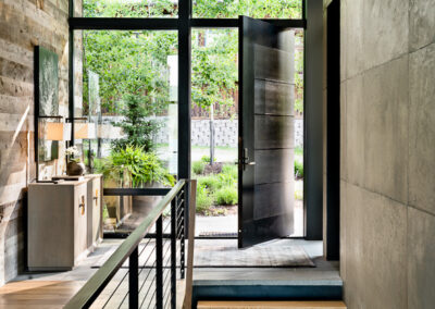 Interior shot of Bonfire Beach project by Bear Mountain Builders with staircase and glass windows